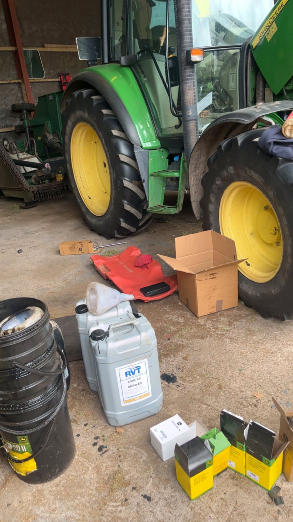 John Deere tractor undergoing a full service with oils and filters